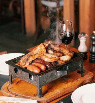 a grill with hot dogs and sausages on it